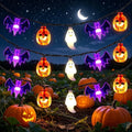 Halloween string lights displayed against a nighttime pumpkin scene