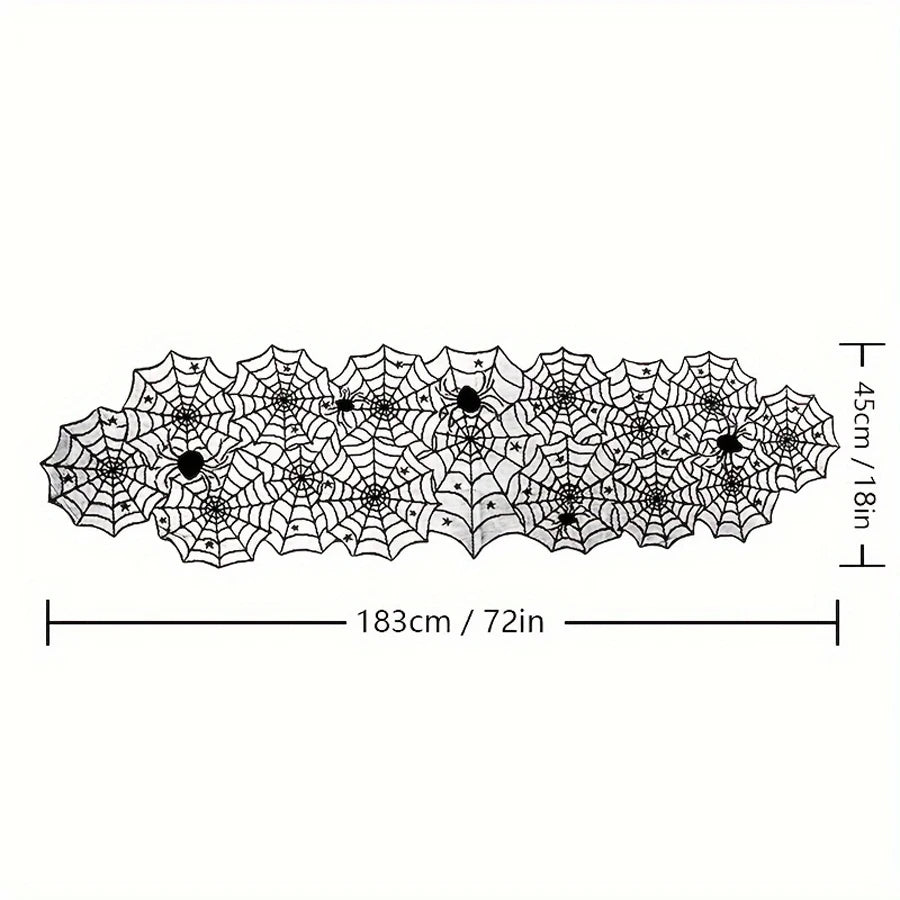 Black spiderweb lace runner draped over a white table with pumpkin decorations