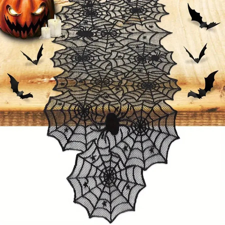 Black spiderweb table runner styled with Halloween decorations
