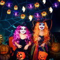 Halloween string lights above a costume party display