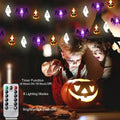 Halloween lights above a pumpkin display with remote-control feature callouts